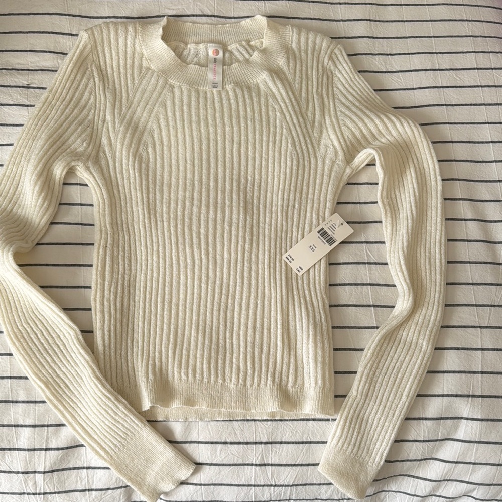 Cream Crew Neck Sweater with Ribbed Knit Texture and Long Sleeves